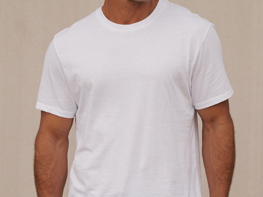 Close-up of the white Apex Tee collar and shoulders